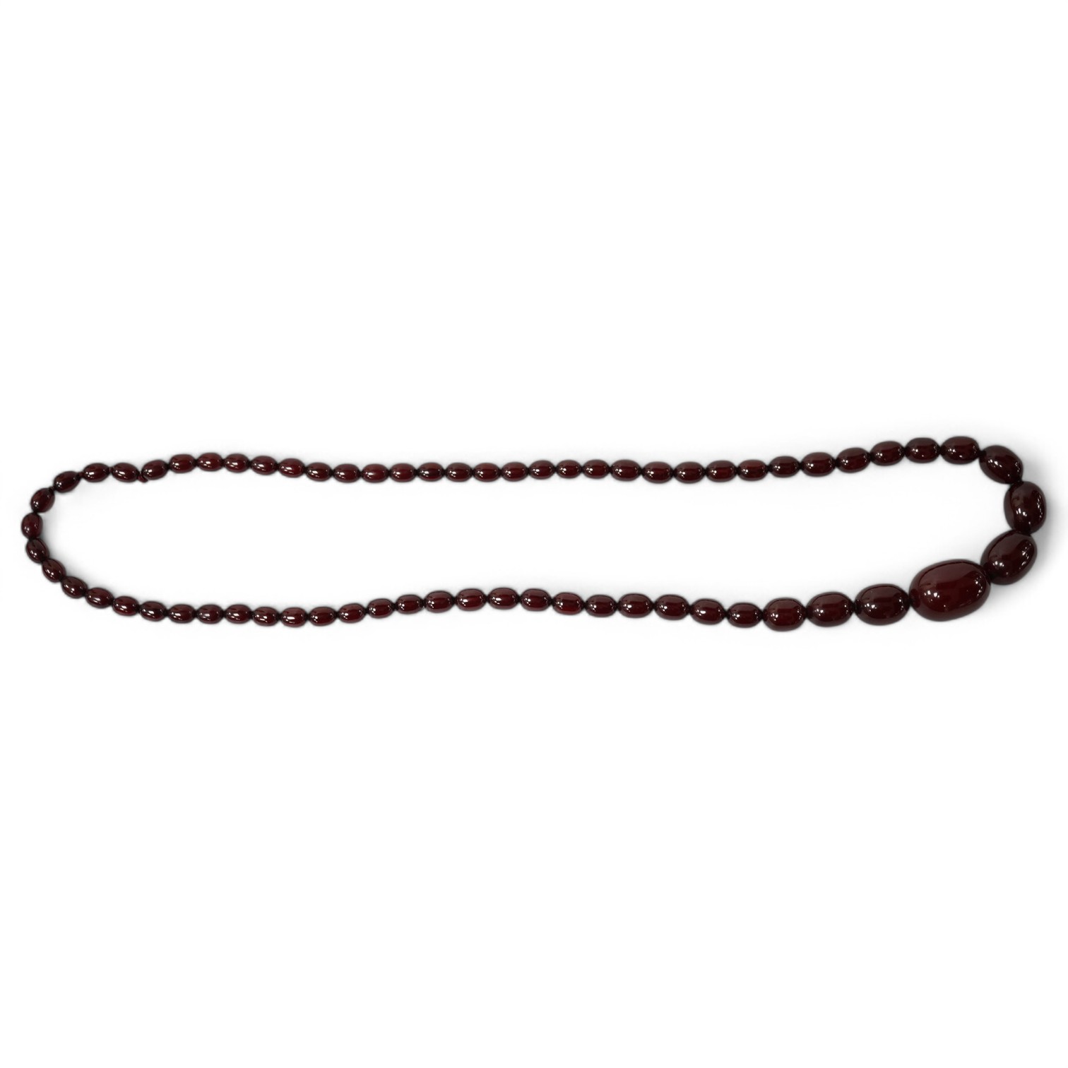 A single strand graduated simulated cherry amber bead necklace, 68cm, gross weight 44 grams. Condition - fair to good